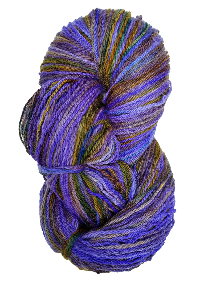 A photo of a purple, blue, yellow and green hank of handspun yarn