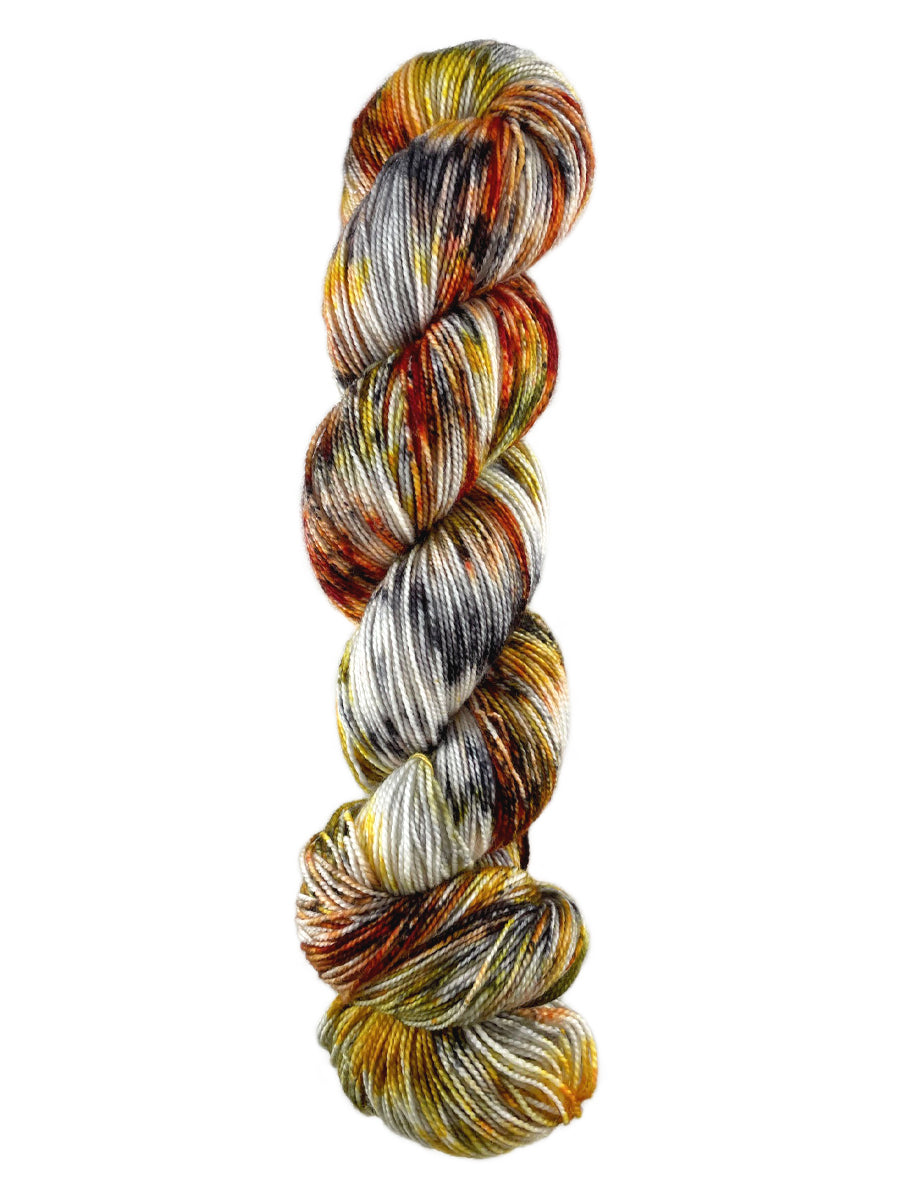 A skein of Western Sky Knits Aspen Sock yarn in Monarch