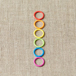 Cocoknits Colorful Ring Stitch Markers on linen background