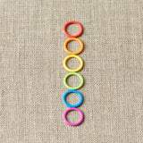 Cocoknits Colorful Ring Stitch Markers on linen background