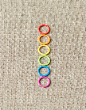 Cocoknits Colorful Ring Stitch Markers on linen background