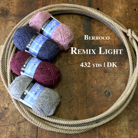 Skeins of Remix Light Yarn on a wooden surface