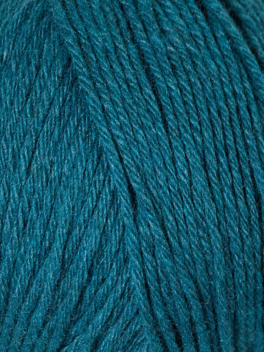 Close up of Berroco Renew yarn , color 1336 Morpho - blue teal yarn