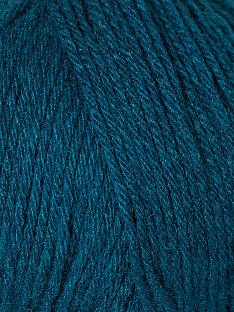 Close up of Berroco Renew yarn, color 1352 Peafowl - dark blue turquoise yarn 