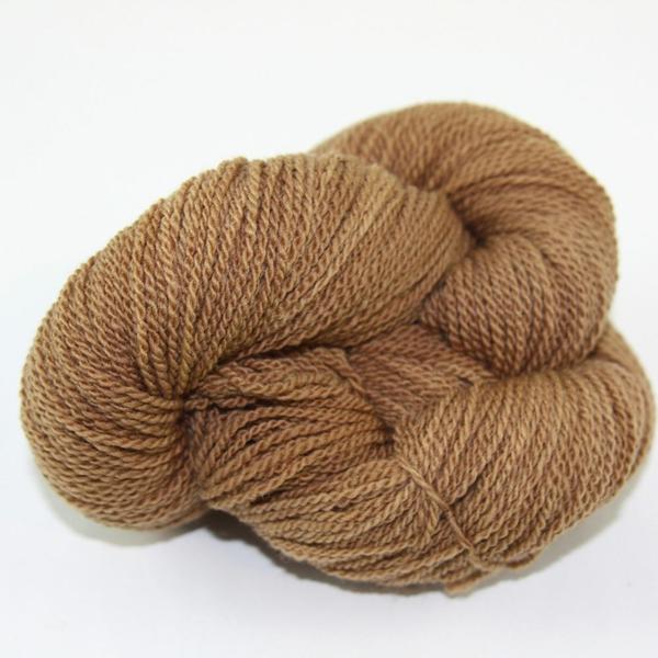 A light brown hank of the Mountain Meadow Wool Saratoga yarn collection