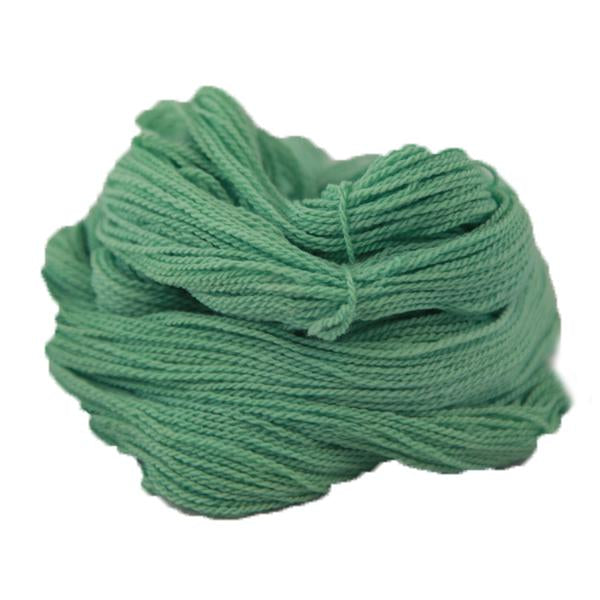 A light green hank of the Mountain Meadow Wool Saratoga yarn collection