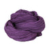 A plum colored hank of the Mountain Meadow Wool Saratoga yarn collection
