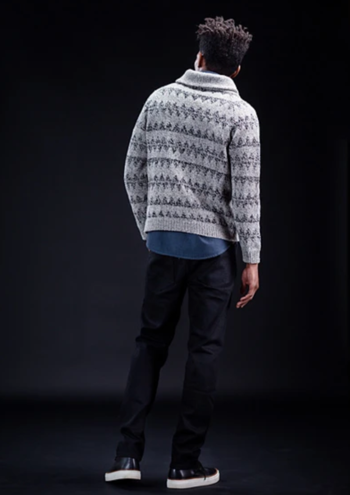 A man wearing a knitted sweater