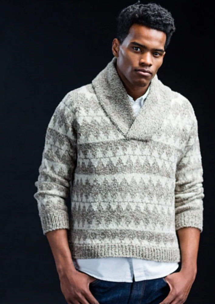 A man wearing a knitted sweater