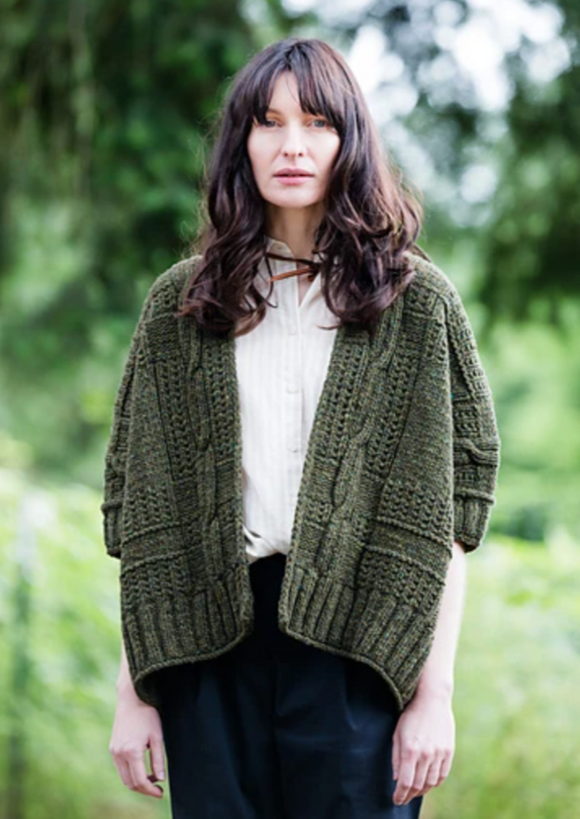 A woman wearing a knitted sweater