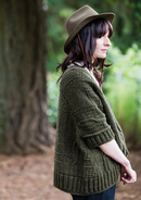 A woman wearing a knitted sweater