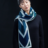 A woman wearing a knitted scarf