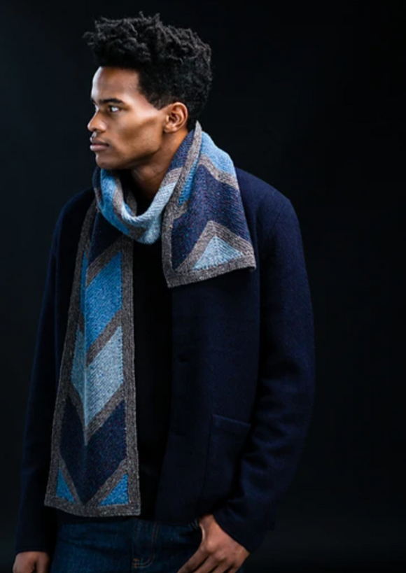 A man wearing a knitted scarf