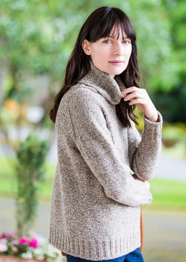A woman wearing a knitted sweater
