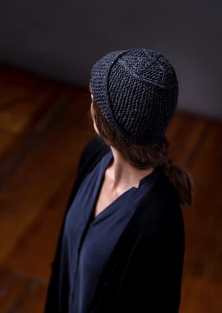A woman wearing a knitted hat