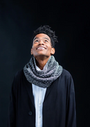 A man wearing a a knitted cowl