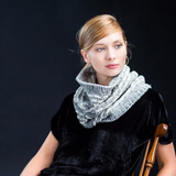 A woman wearing a a knitted cowl