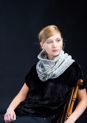 A woman wearing a a knitted cowl