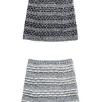 Two knitted cowls on a white surface