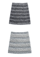 Two knitted cowls on a white surface