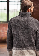 A man wearing a knitted turtleneck sweater