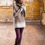 A woman wearing a knitted turtleneck sweater