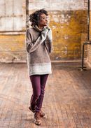 A woman wearing a knitted turtleneck sweater