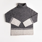 A knitted turtleneck sweater