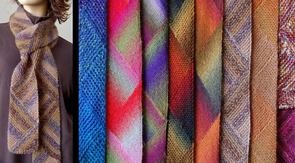 A woman wearing a multicolored scarf alongside other colorful scarves