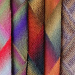 A group of multicolored scarves