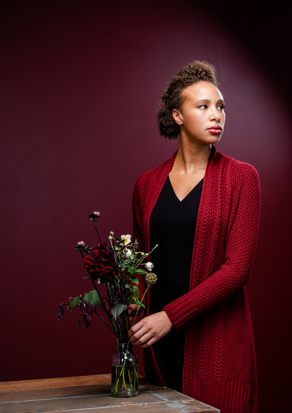 A woman wearing a knitting cardigan