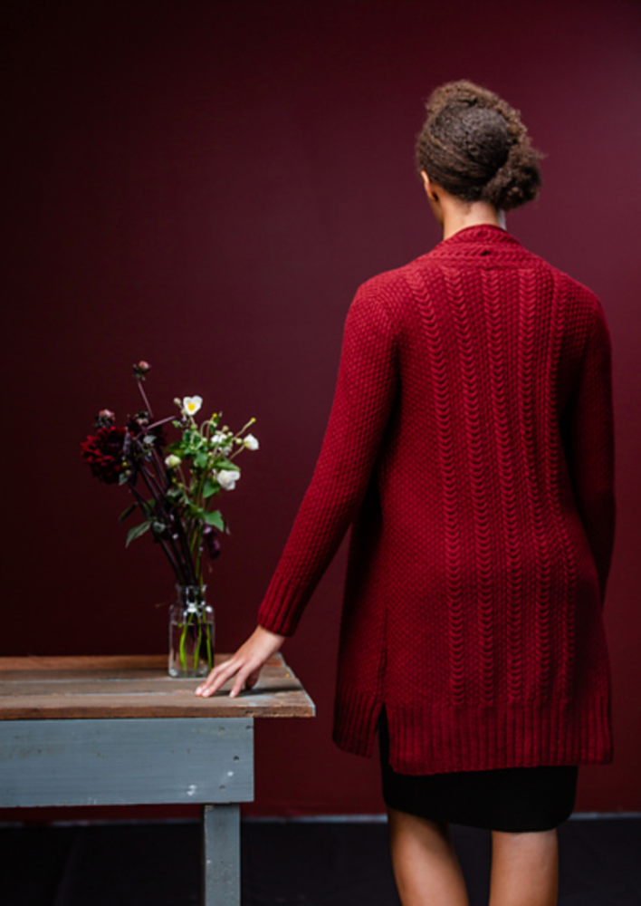 A woman wearing a knitting cardigan