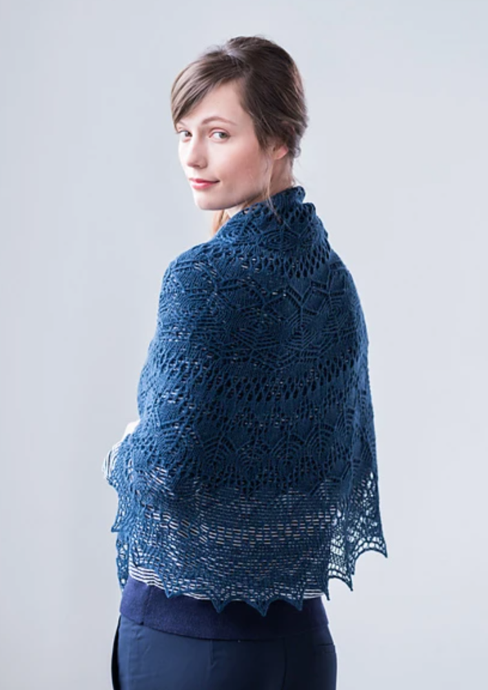 A woman wearing a lacy pi shawl