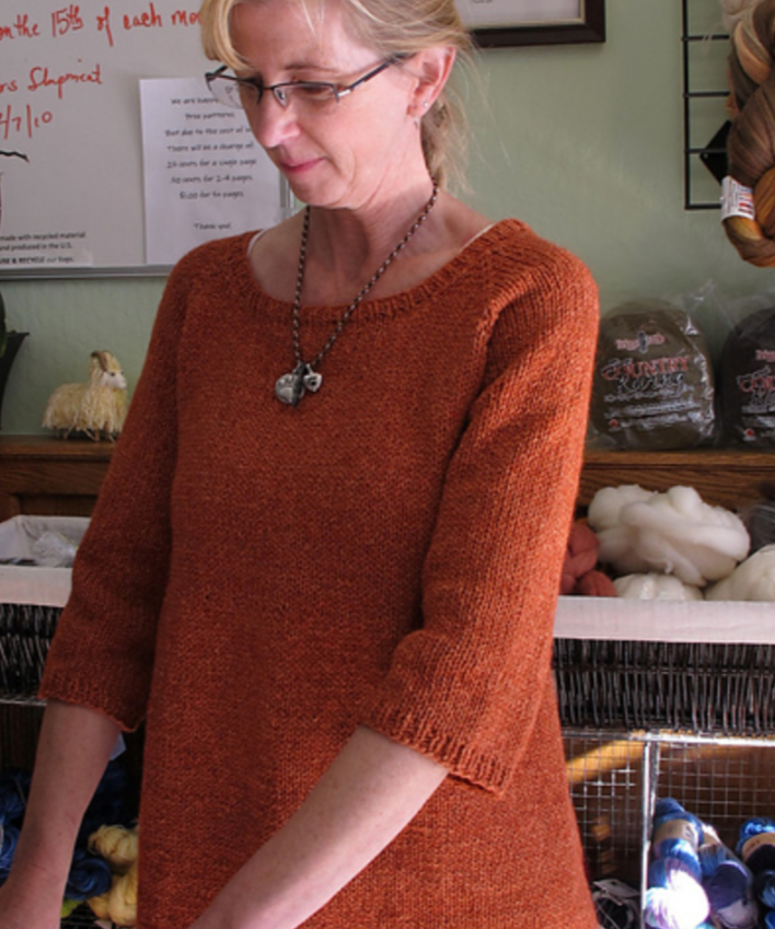 A woman wearing a knitted sweater