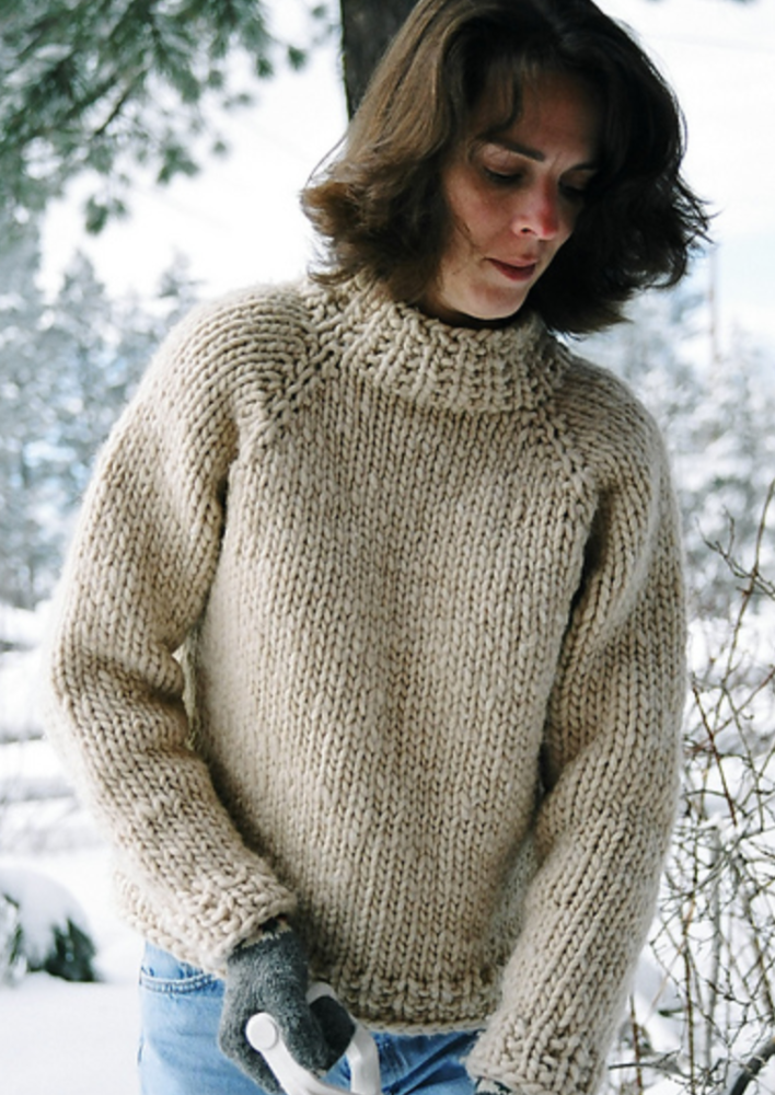 A woman wearing a knitted sweater