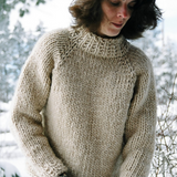 A woman wearing a knitted sweater