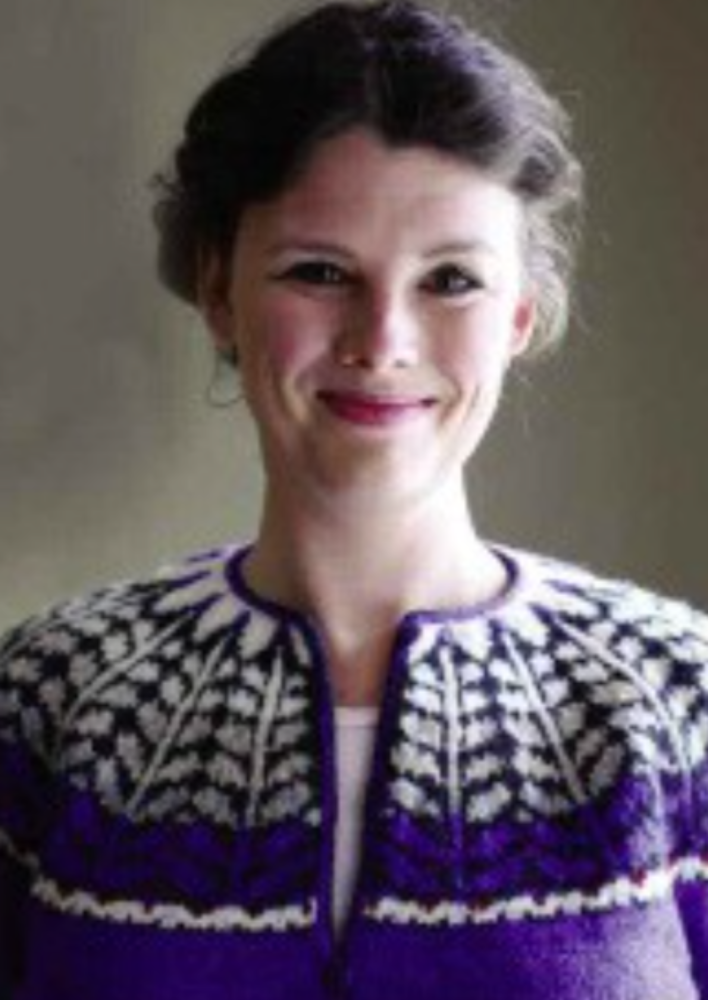 A woman wearing a colorwork sweater