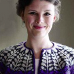 A woman wearing a colorwork sweater