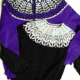 Two knitted, colorwork sweaters on a white background