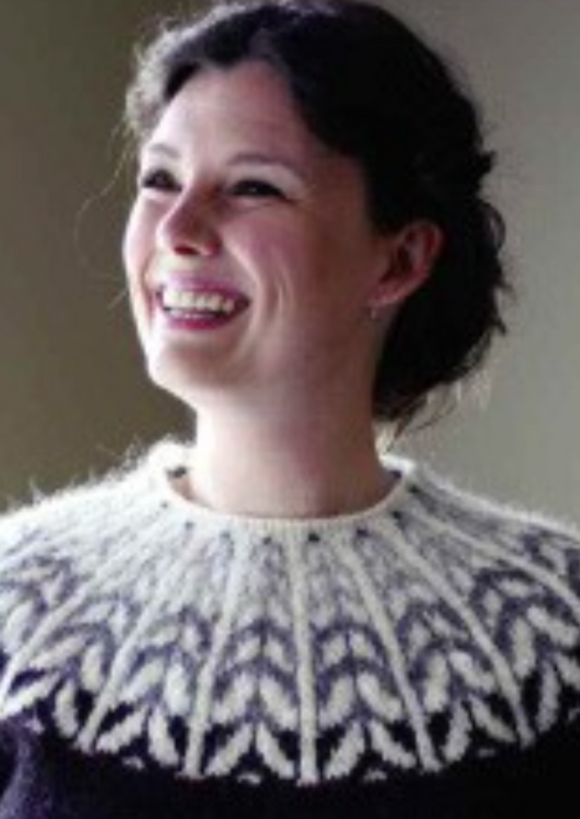 A woman wearing a colorwork sweater