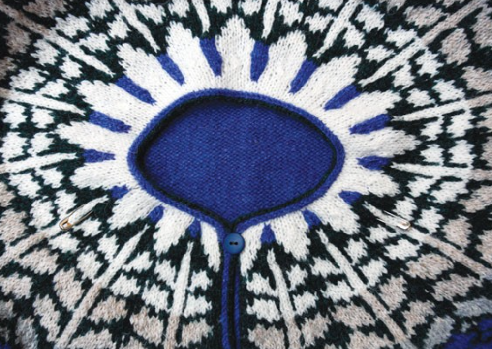 A close-up photo of a knitted, colorwork yoke