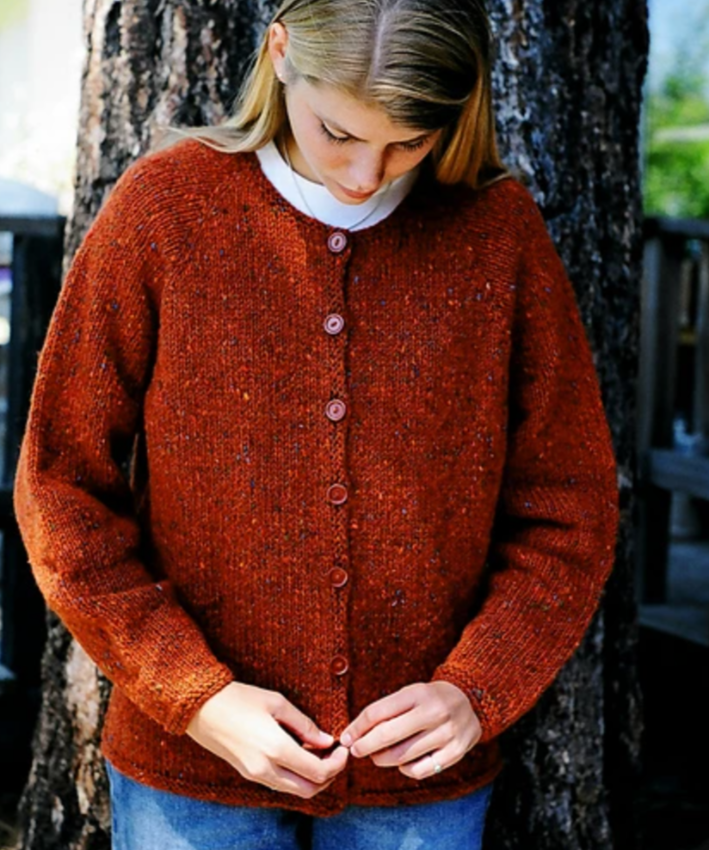 A woman wearing a knitted sweater