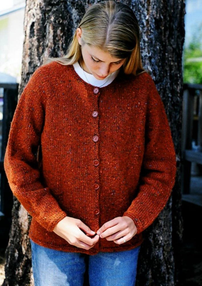 A woman wearing a knitted sweater