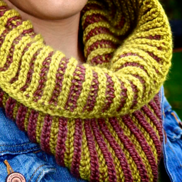 A woman wearing a knitted brioche cowl