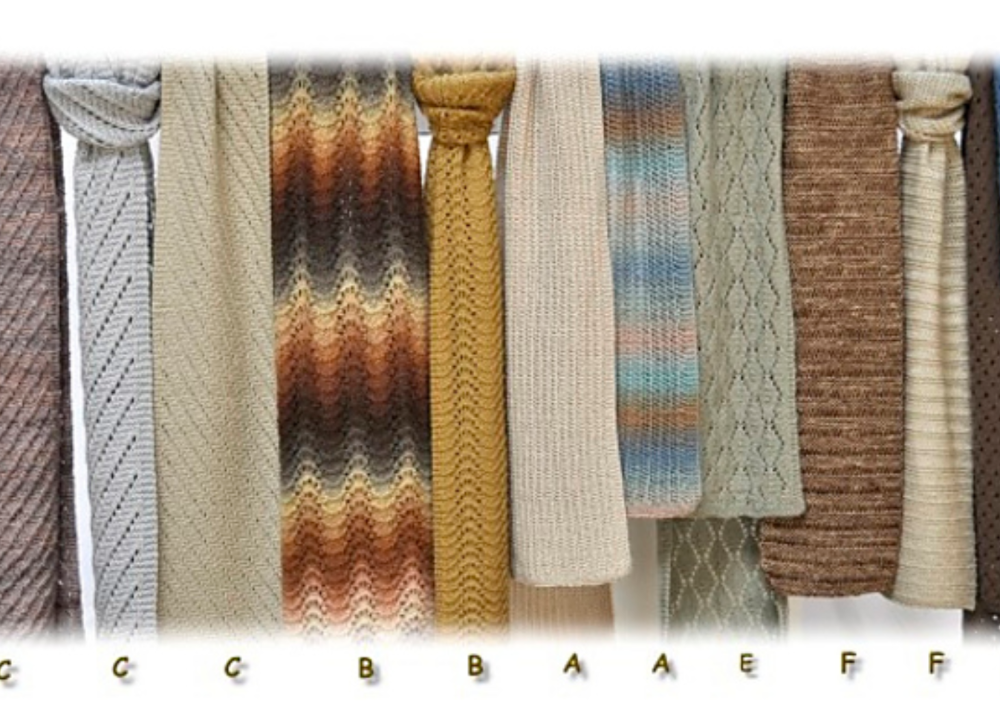 A row of different knitted scarves