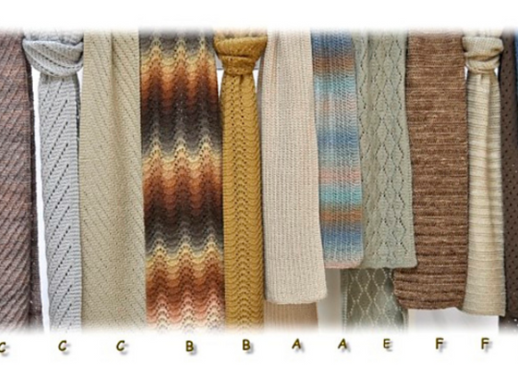 A row of different knitted scarves