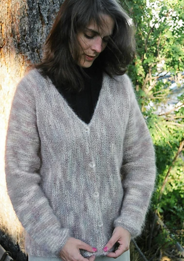 A woman wearing a knitted cardigan sweater