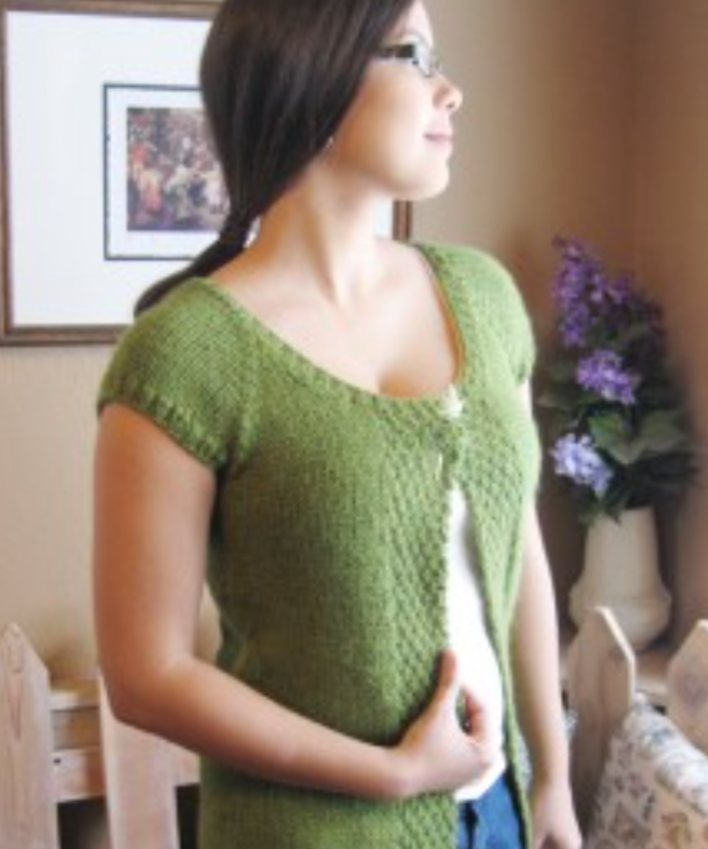 A woman wearing knitted cardigan sweater