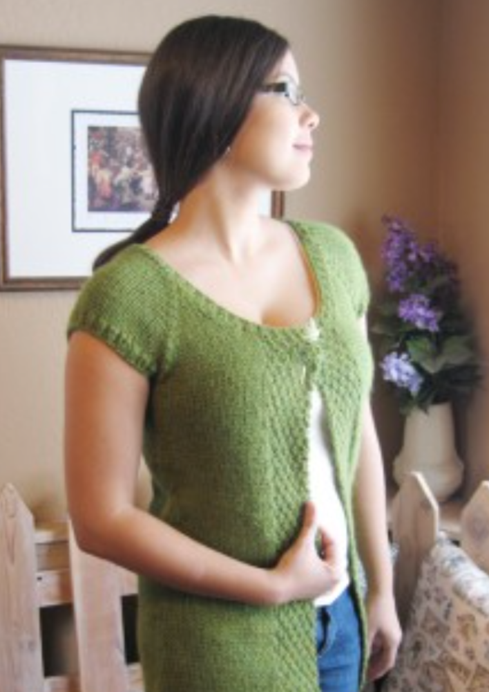 A woman wearing knitted cardigan sweater