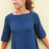 A woman wearing a knitted sweater